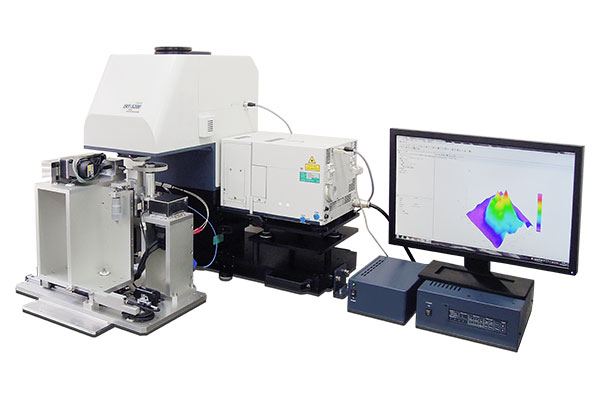 Photograph of a typical ball-on-disk tester with micro-FTIR